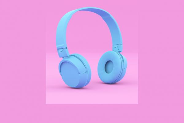 Blue headphones on a pink background