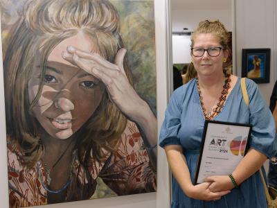 City of Gosnells Community Art Exhibition and Awards Overall Acquisitive Prize  winner Eve Wolfe with her portrait of her daughter, titled Forever 18