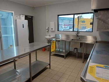 Amherst-kitchen-showing-benches-and-fridge.jpeg