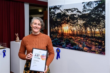Winning artist with their artwork