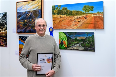 Winning artist with their artwork