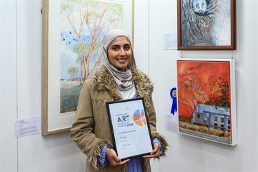 Winning artist with their artwork
