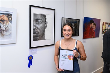 Winning artist with their artwork
