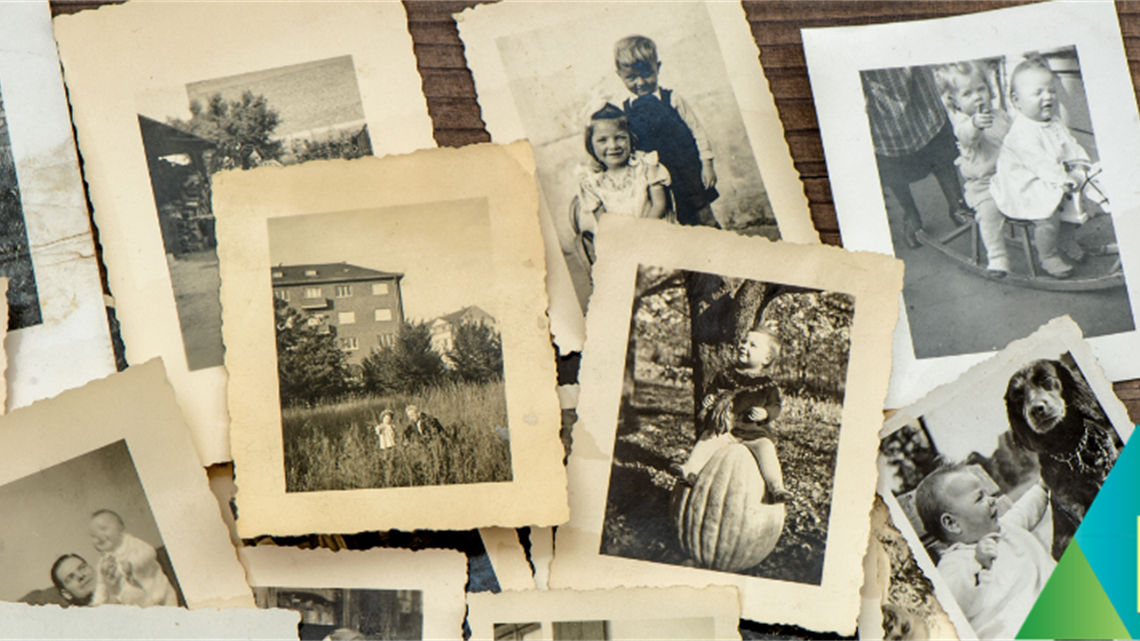 Scattered, yellowing old photos of people