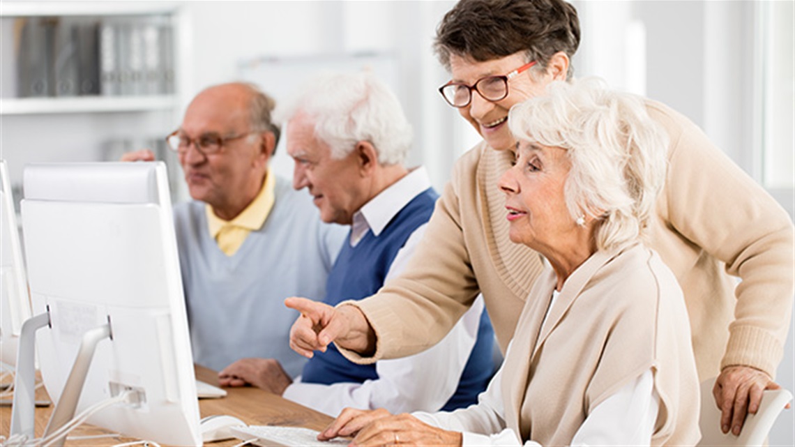 seniors being taught computer use.jpg