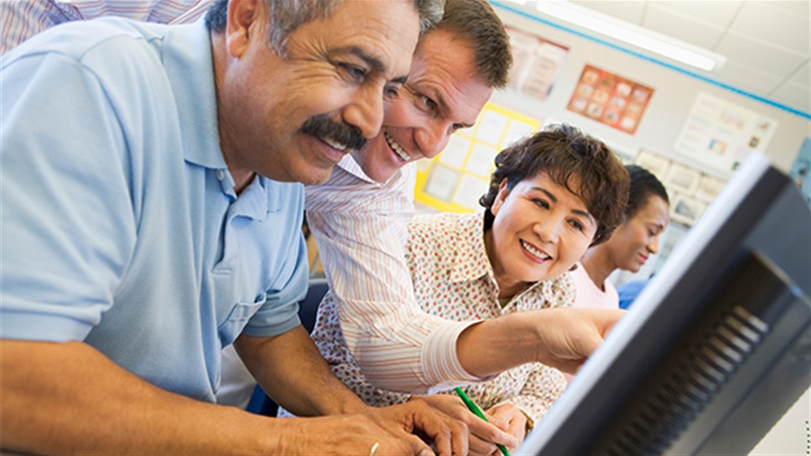 man teaching people to use computers.jpg