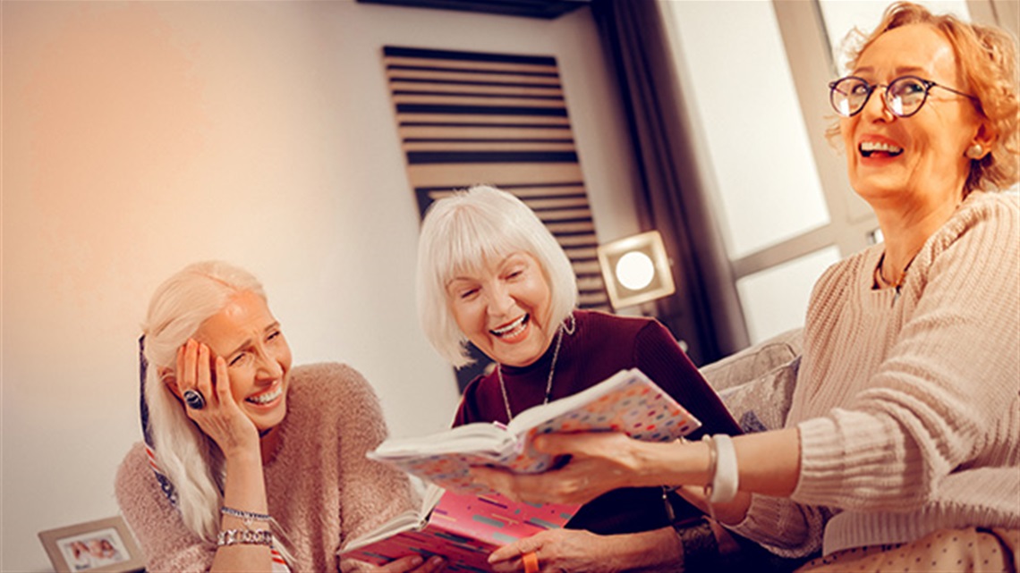 three happy ladies with books.jpg