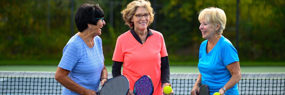 Active seniors bonding at the tennis court_0.jpg