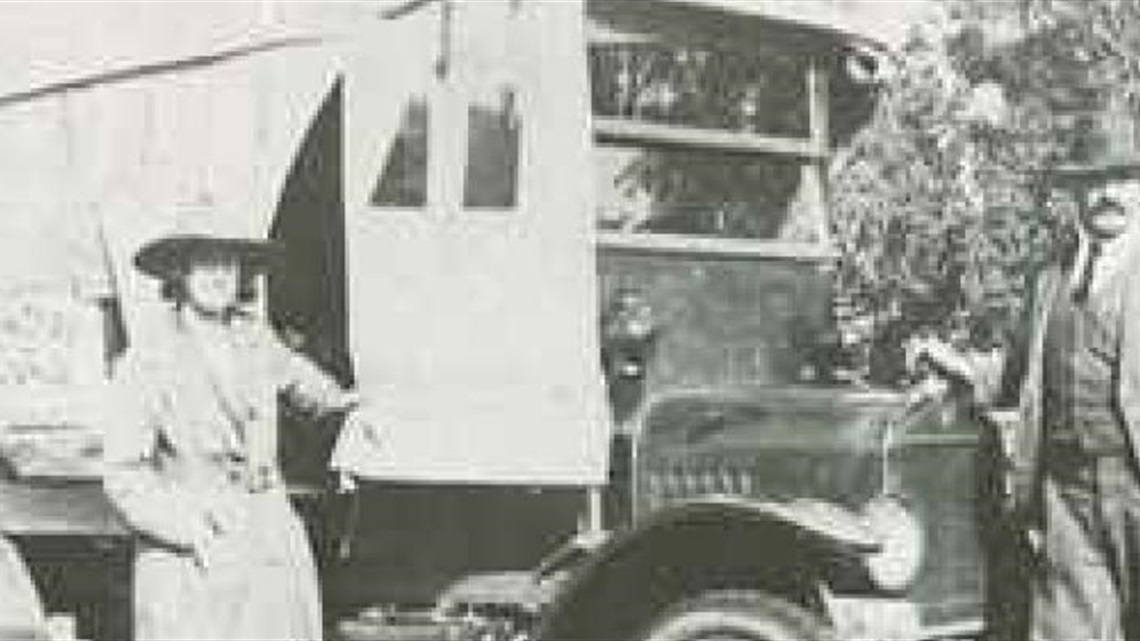 Miss_Grace_Michel_Mr_Baumberger_and_his_bus_circa_1924.jpg