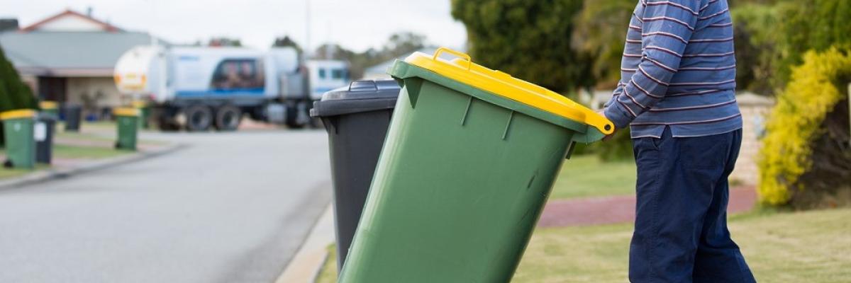 Man putting recycling bin out in Gosnells 