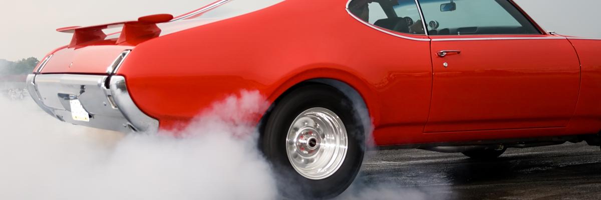 Vehicle - Action - Red car burning rubber