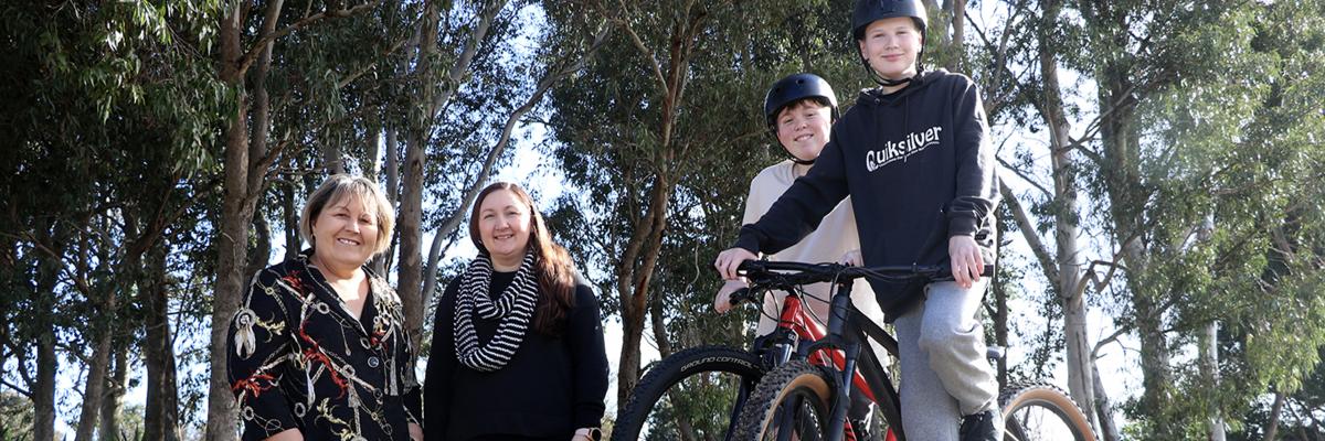 Mayor Terresa Lynes and Councillor Serena Williamson with Laith Powell and Cam Sutherland at Nolan Avenue Reserve where the boys are building a dirt pump track.