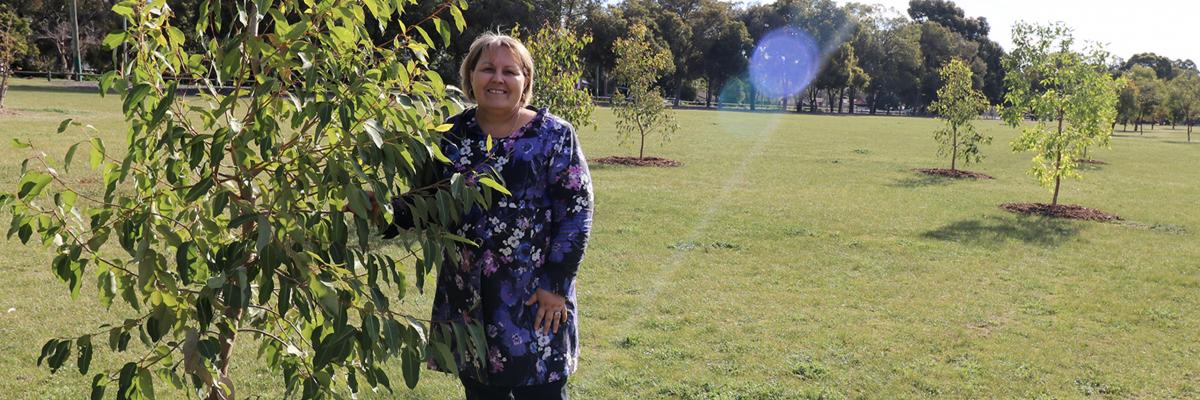Mayor Terresa Lynes with the recently-planted tree she sponsored to celebrate the birth of her first grandchild, at the City of Gosnells Community Forest at John Okey Davis Park in Gosnells.
