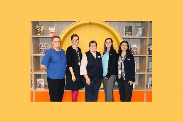 Five female staff at mills park library