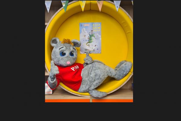 Possum suit with Children's Book Week poster