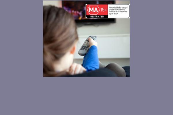 Woman watching television with an MA rating sticker