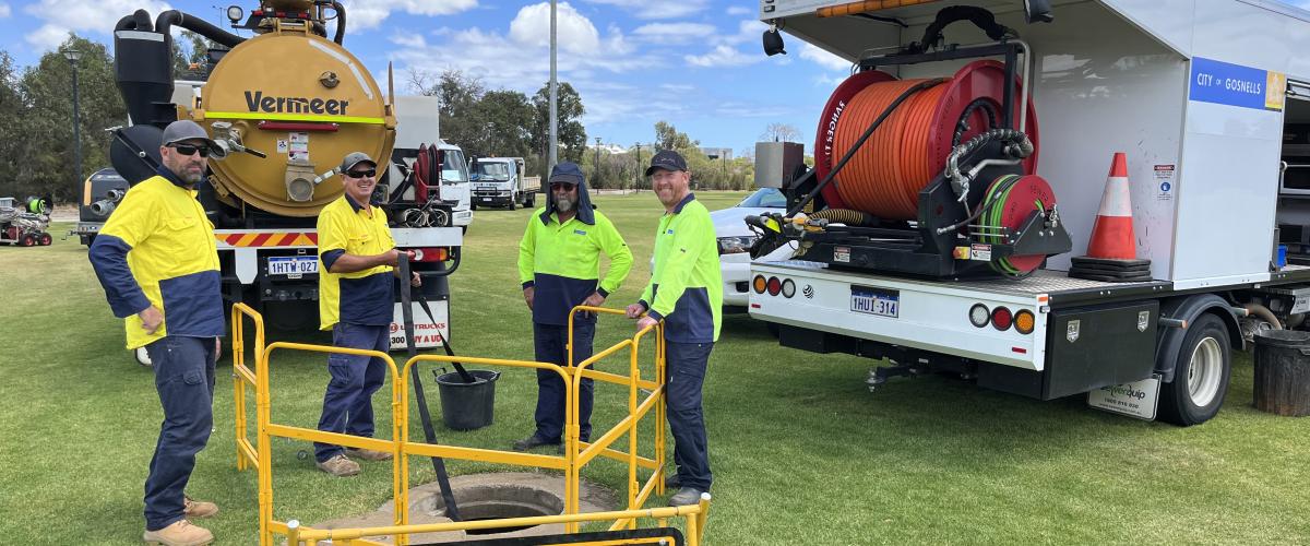 City of Gosnells staff surround a drainage outlet where the Smart Drainage initiative is being implemented.