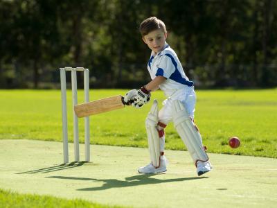 Boy playing cricket 