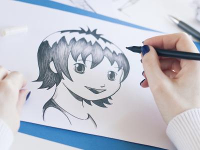 image of female drawing manga 