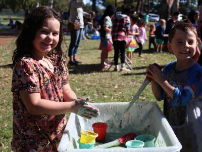 2 children playing with sensory play at Park Play