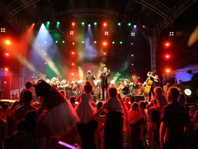 Perth Symphony Orchestra on stage performing in front of a crowd