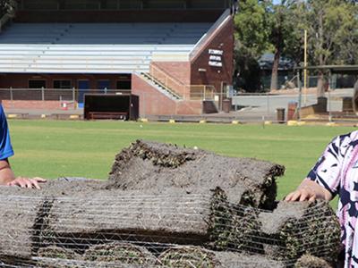 Mayor Terresa Lynes and Gosnells Football Club President Brayden Watkins with the new grass at Gosnells Oval.