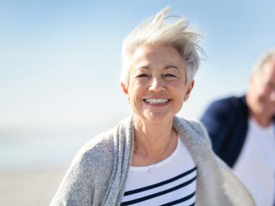 Senior woman smiling at beach
