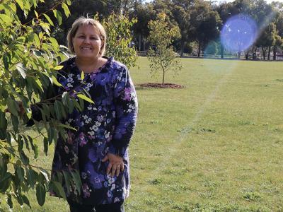 Mayor Terresa Lynes with the recently-planted tree she sponsored to celebrate the birth of her first grandchild, at the City of Gosnells Community Forest at John Okey Davis Park in Gosnells.