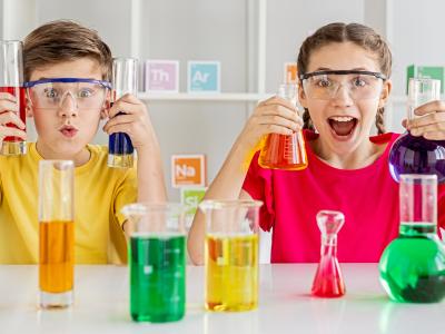 Children with colourful test tubes