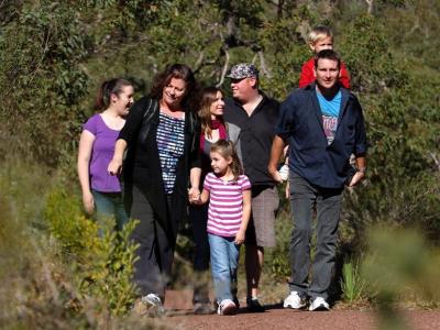 Family hiking on a bush trail