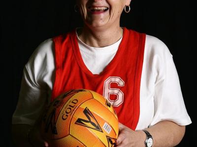 Older woman holding a basketball